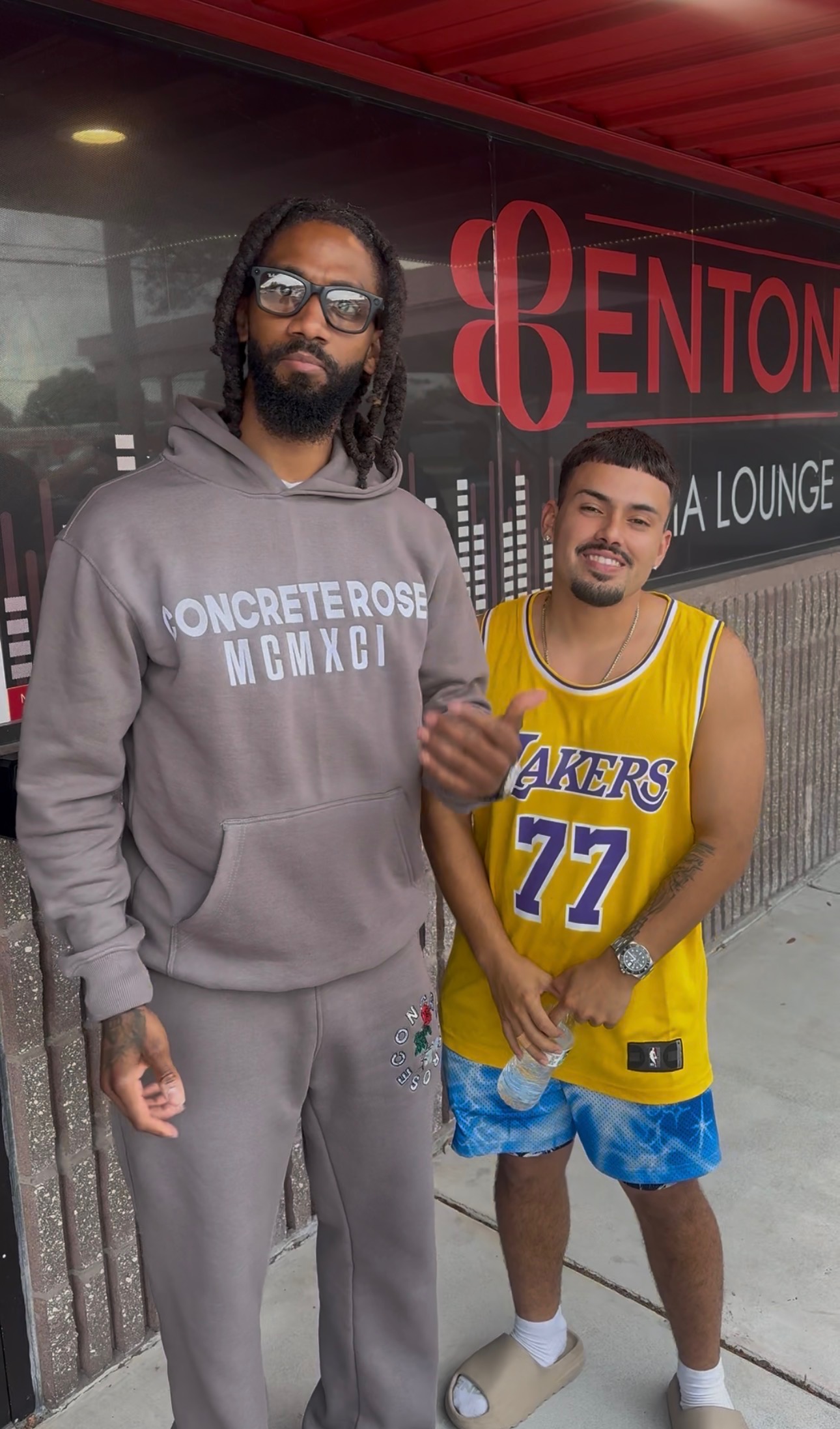 Two people wearing Concrete Rose 91 apparel
